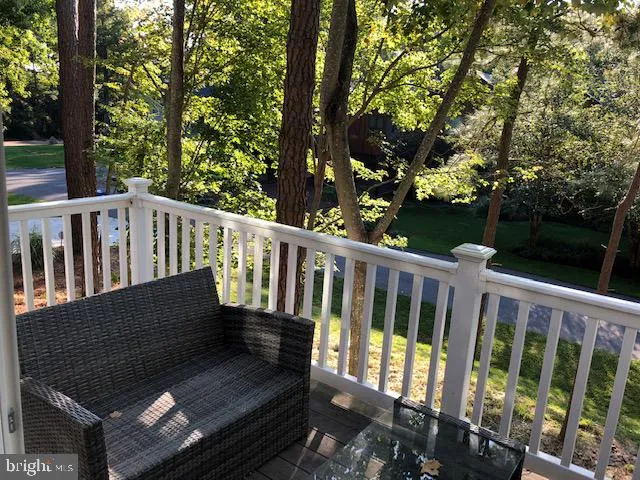 a view of a chairs and table in patio