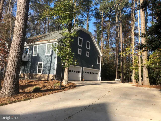 a view of a building with a snow on the road