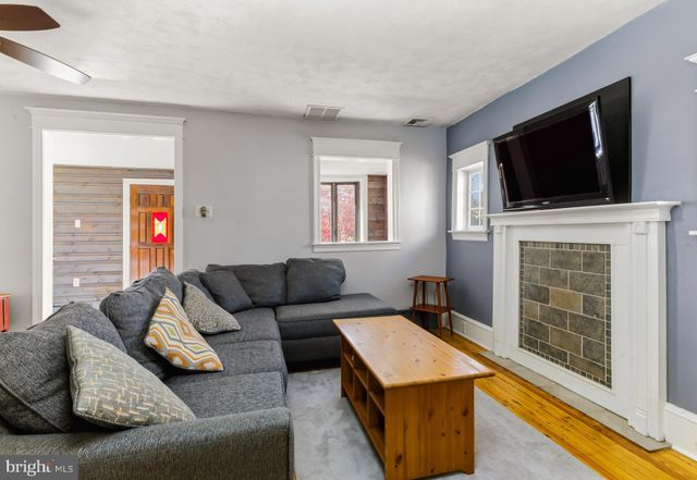 a kitchen with stainless steel appliances a stove a microwave a sink and a refrigerator