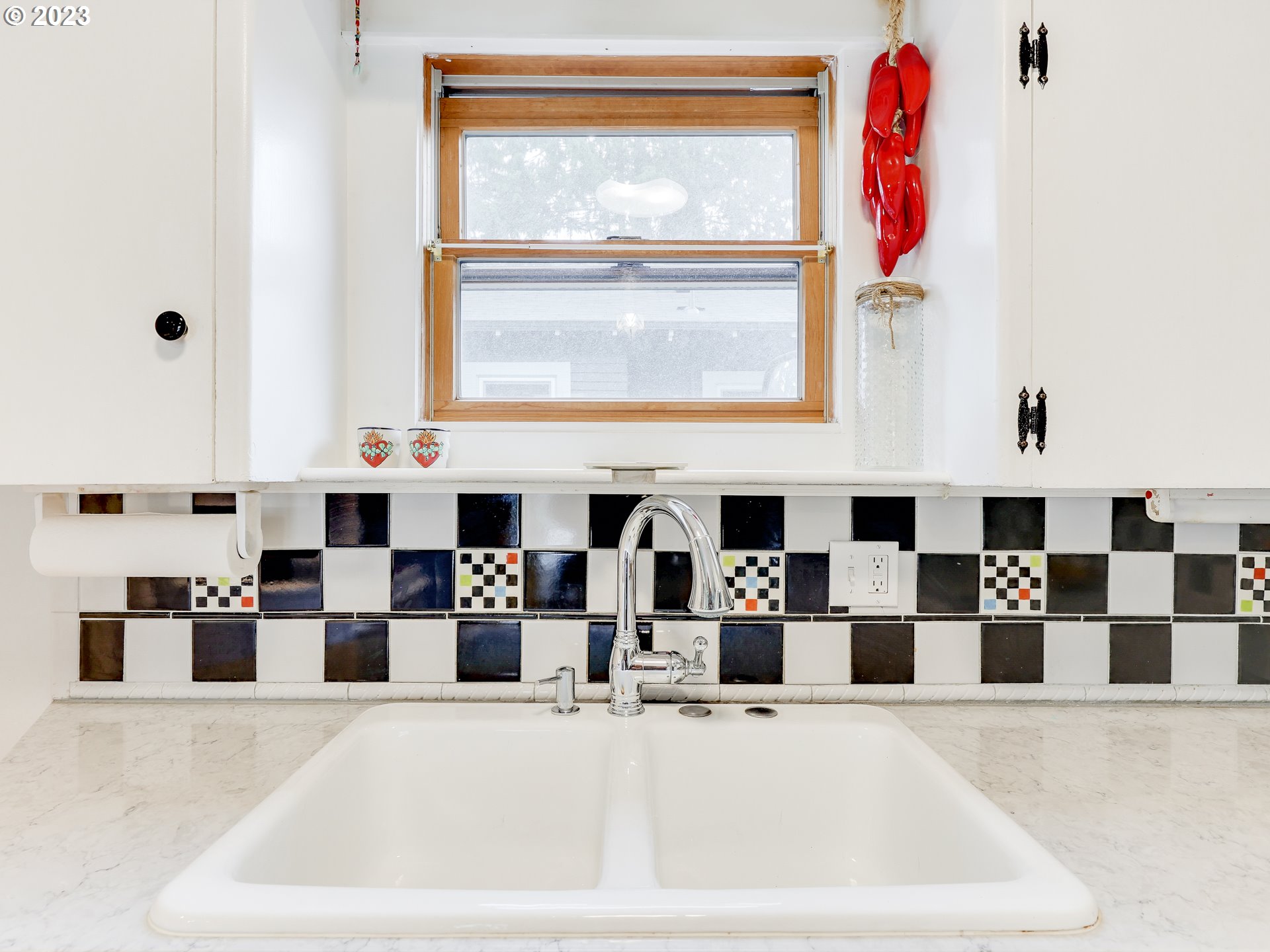 4936 Southeast 76th Avenue Portland, OR 97206 - Photo 15 of 47 a kitchen with a refrigerator and a window