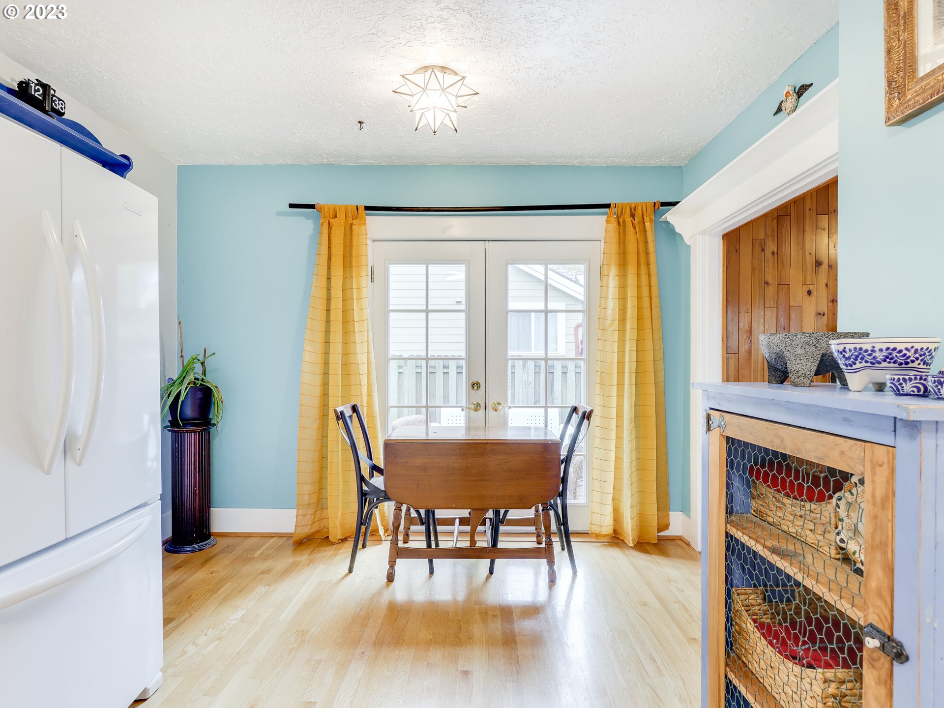 4936 Southeast 76th Avenue Portland, OR 97206 - Photo 17 of 47 a view of a dining room with furniture window and wooden floor