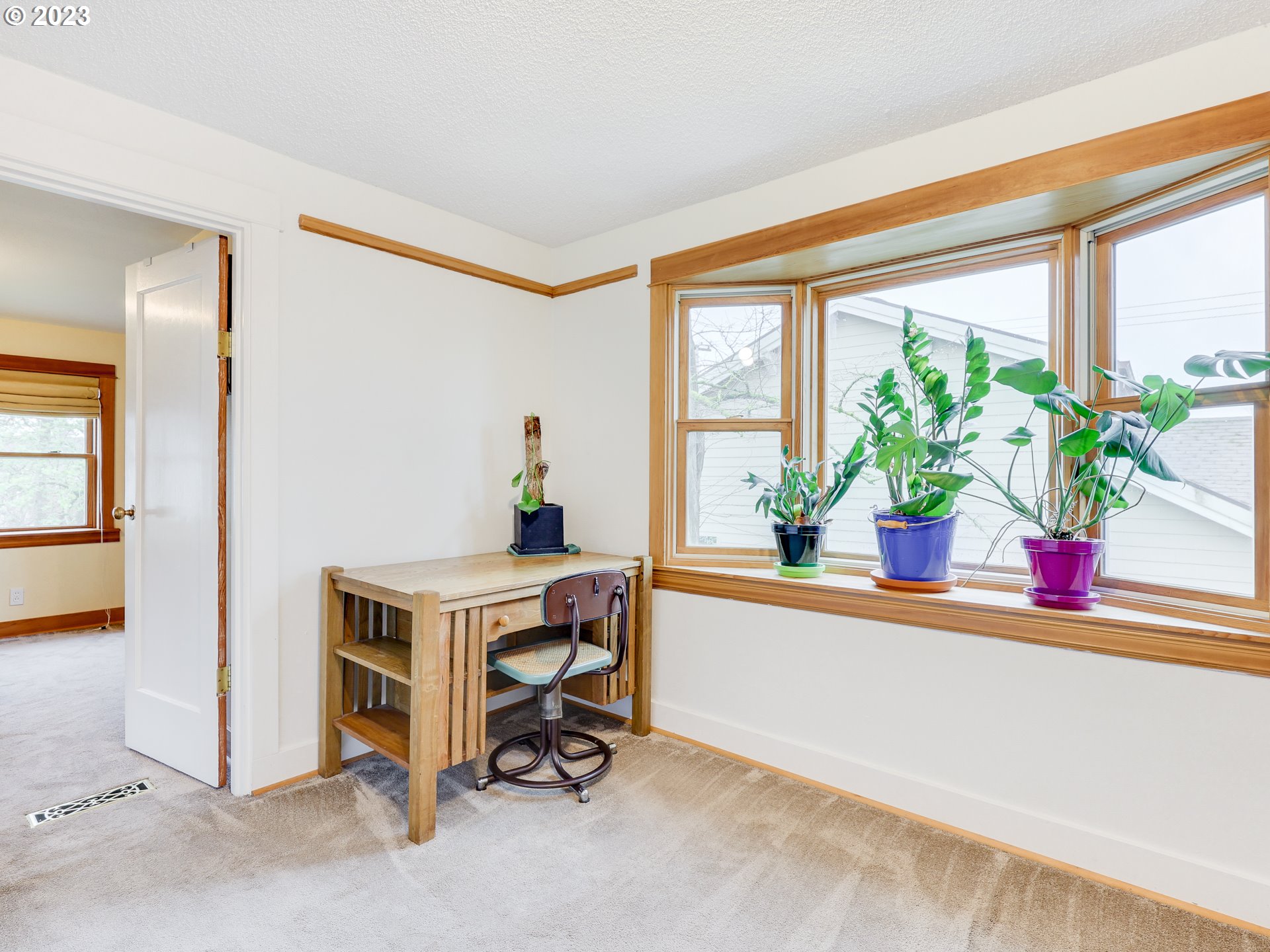 4936 Southeast 76th Avenue Portland, OR 97206 - Photo 21 of 47 a view of living room filled with furniture and a potted plant