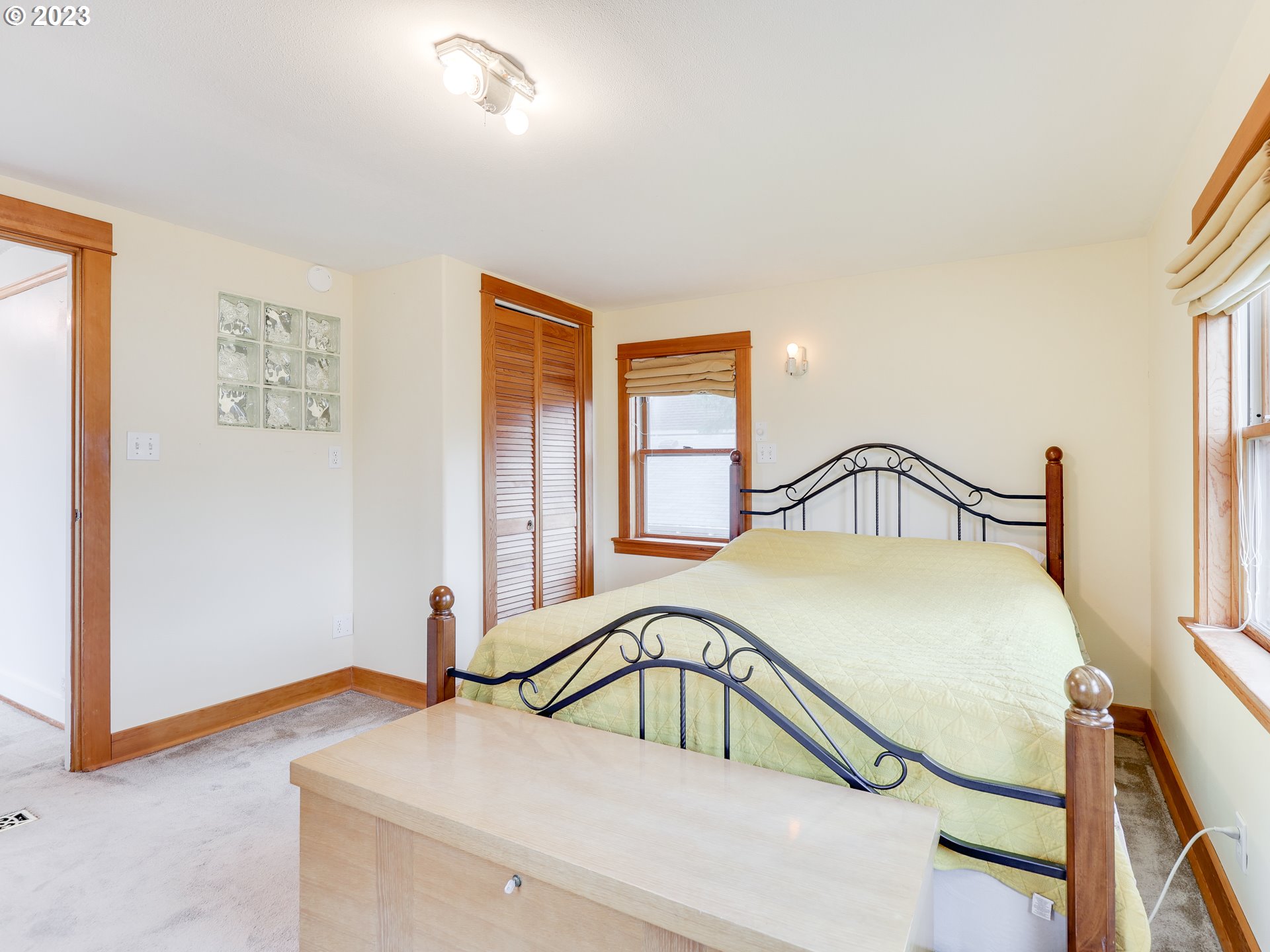 4936 Southeast 76th Avenue Portland, OR 97206 - Photo 24 of 47 a bedroom with a bed and a window