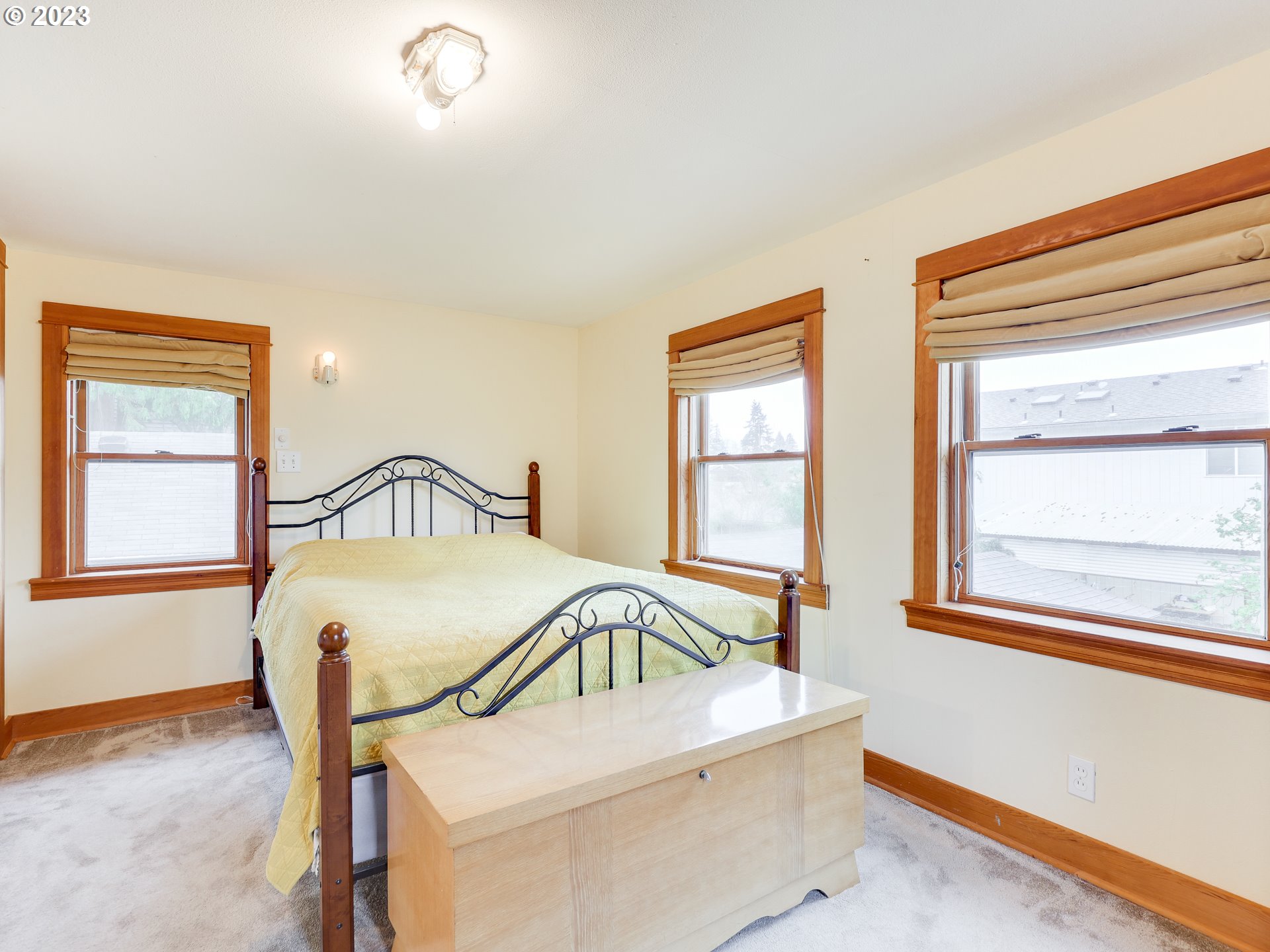 4936 Southeast 76th Avenue Portland, OR 97206 - Photo 25 of 47 a bedroom with a bed and window