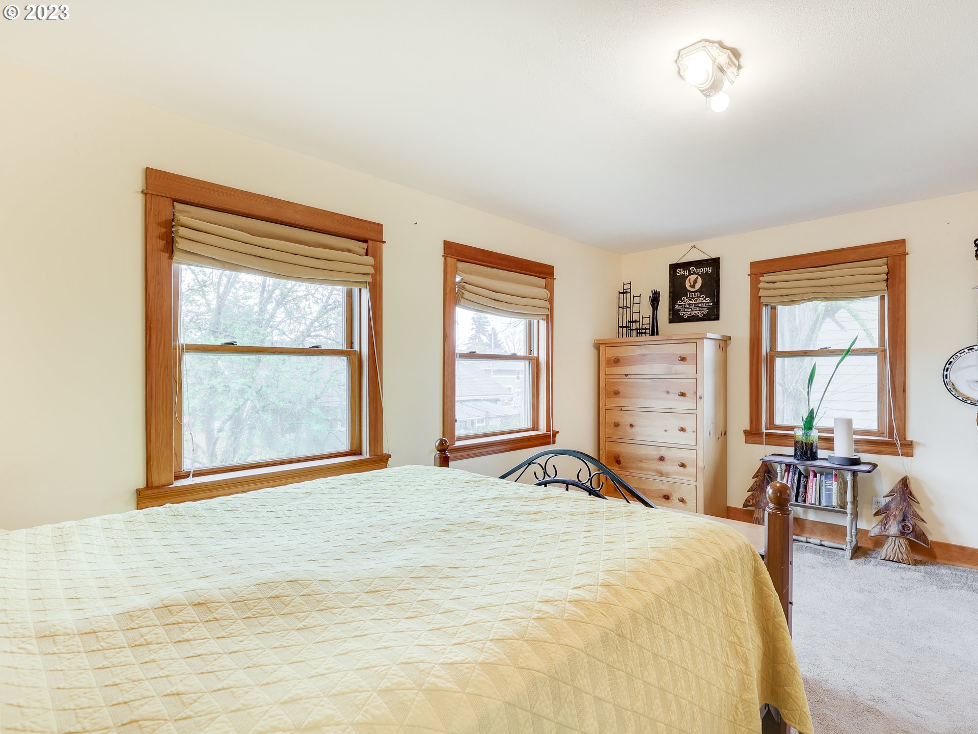 4936 Southeast 76th Avenue Portland, OR 97206 - Photo 27 of 47 a bedroom with a bed and wooden floor