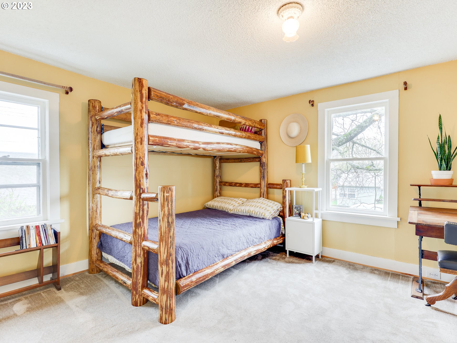 4936 Southeast 76th Avenue Portland, OR 97206 - Photo 28 of 47 a bedroom with a bed and a window