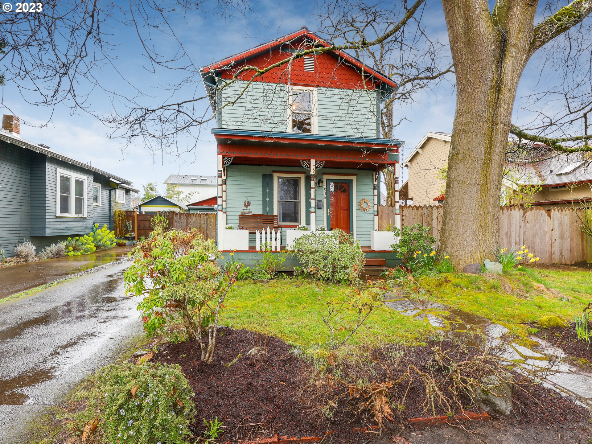 4936 Southeast 76th Avenue Portland, OR 97206 - Photo 3 of 47 a front view of a house with garden