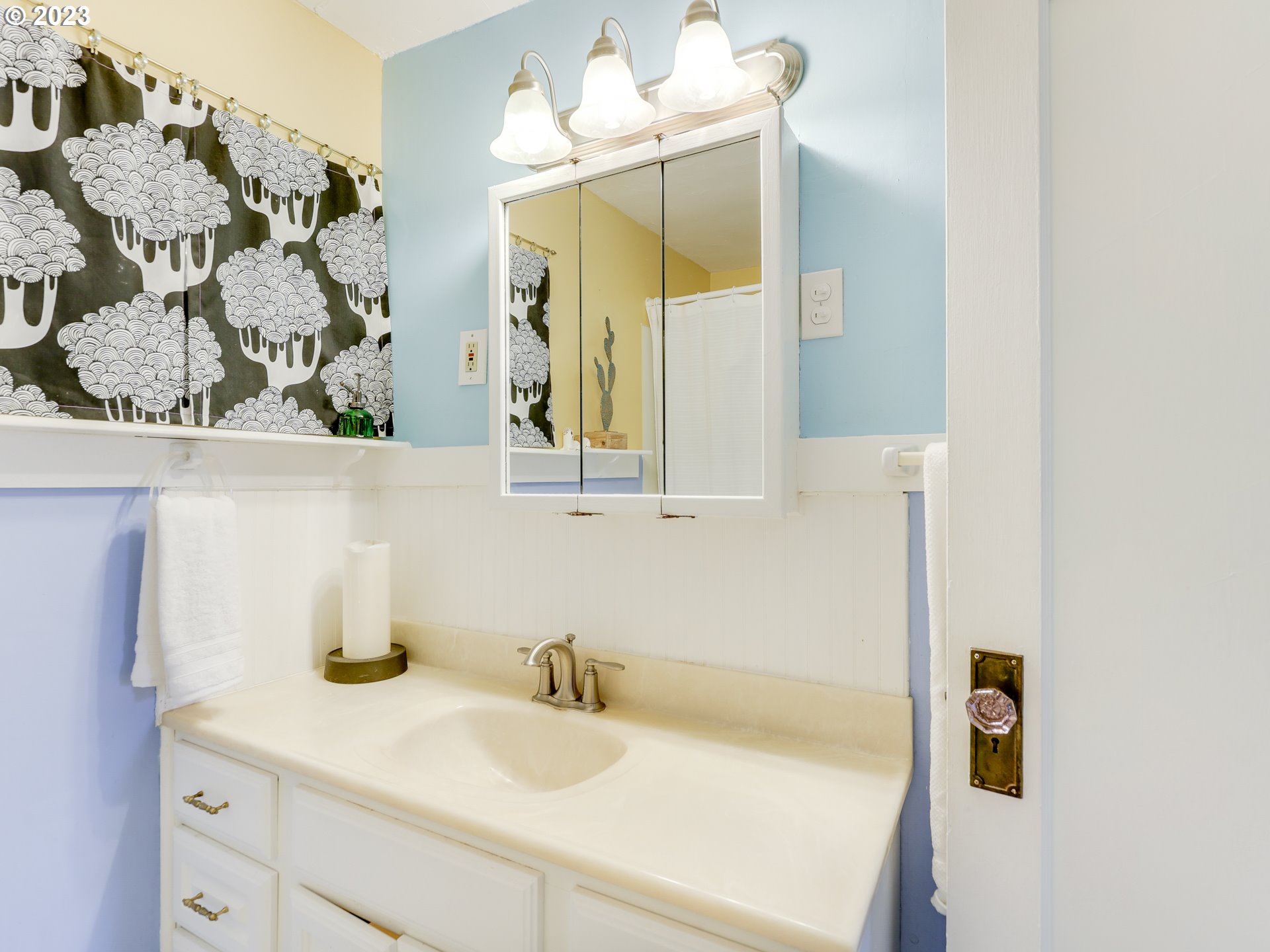 4936 Southeast 76th Avenue Portland, OR 97206 - Photo 31 of 47 a bathroom with a sink and a mirror