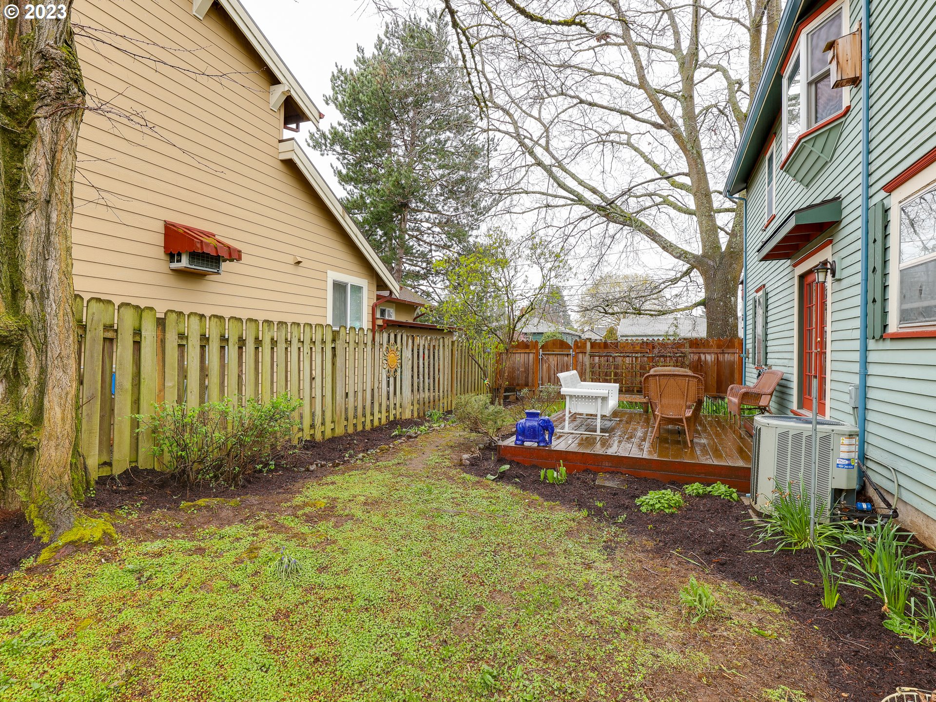 4936 Southeast 76th Avenue Portland, OR 97206 - Photo 38 of 47 a view of a chair and table in backyard of the house