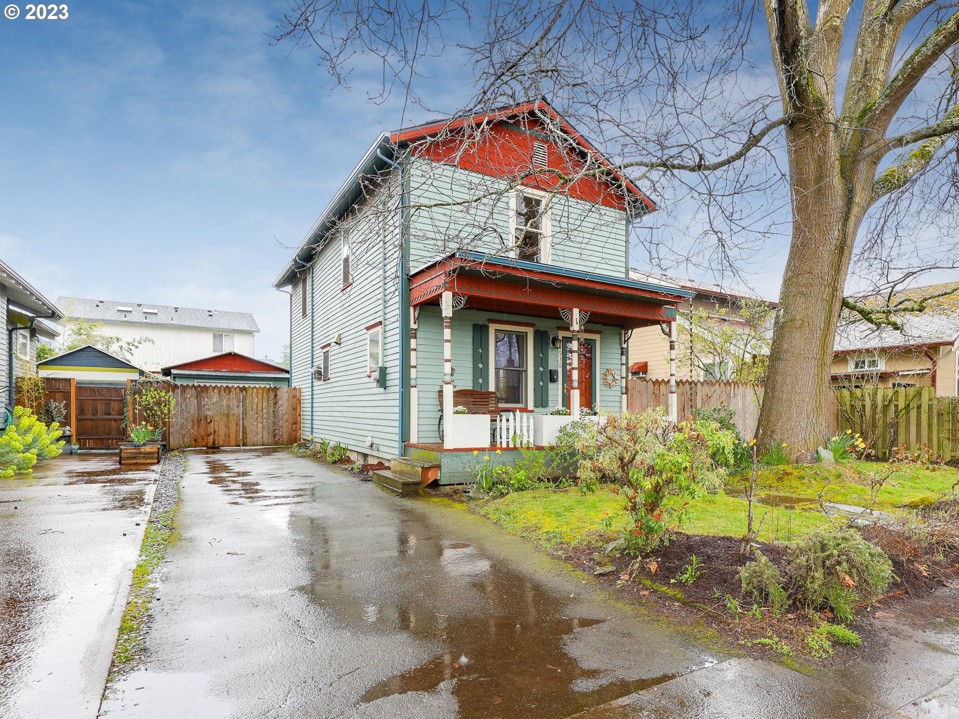 4936 Southeast 76th Avenue Portland, OR 97206 - Photo 4 of 47 a view of a house with a yard