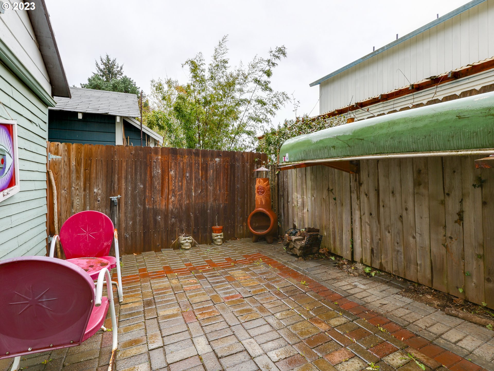 4936 Southeast 76th Avenue Portland, OR 97206 - Photo 44 of 47 a backyard of a house with table and chairs