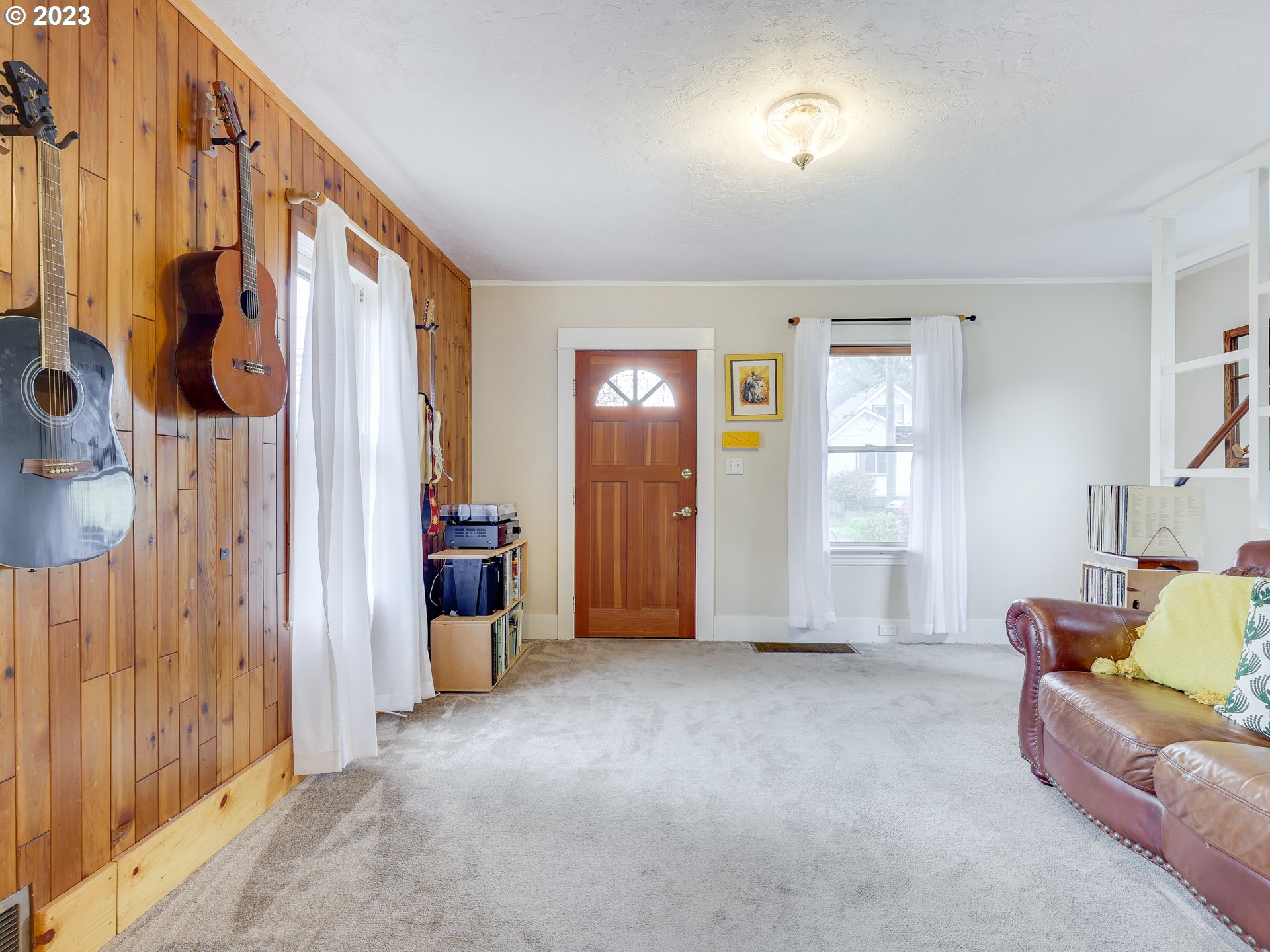 4936 Southeast 76th Avenue Portland, OR 97206 - Photo 9 of 47 a view of a livingroom with furniture and staircase