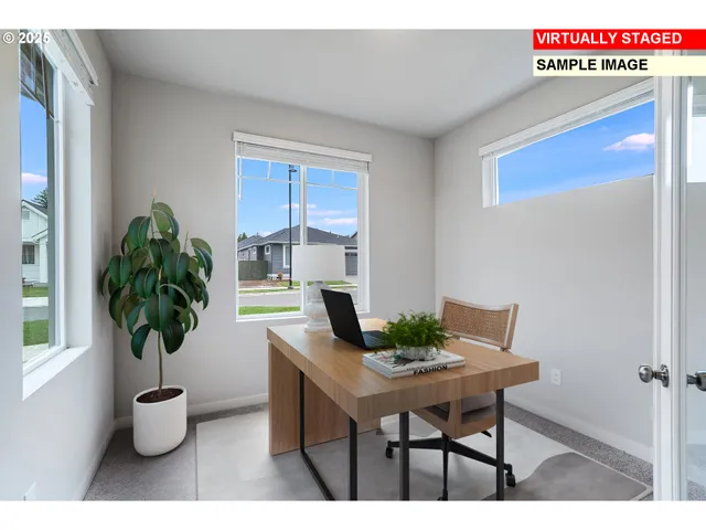 a workspace with furniture and potted plant