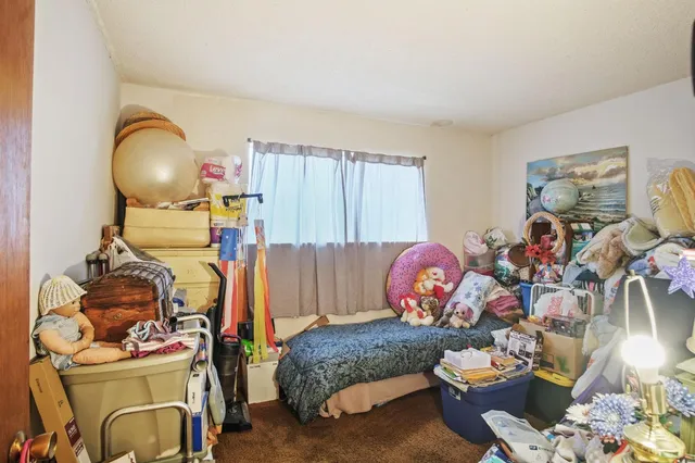a living room with furniture and a mirror