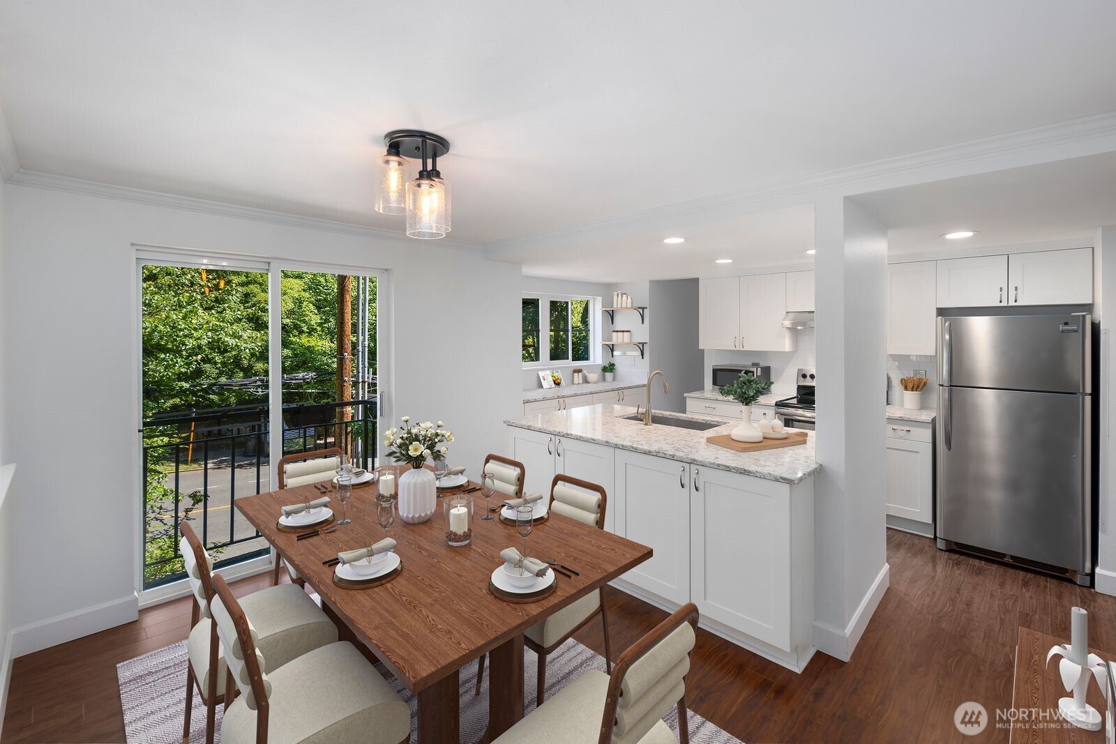 3901 Fremont Avenue North, Unit 202 Seattle, WA 98103 - Photo 7 of 23 a kitchen with a table and chairs in it