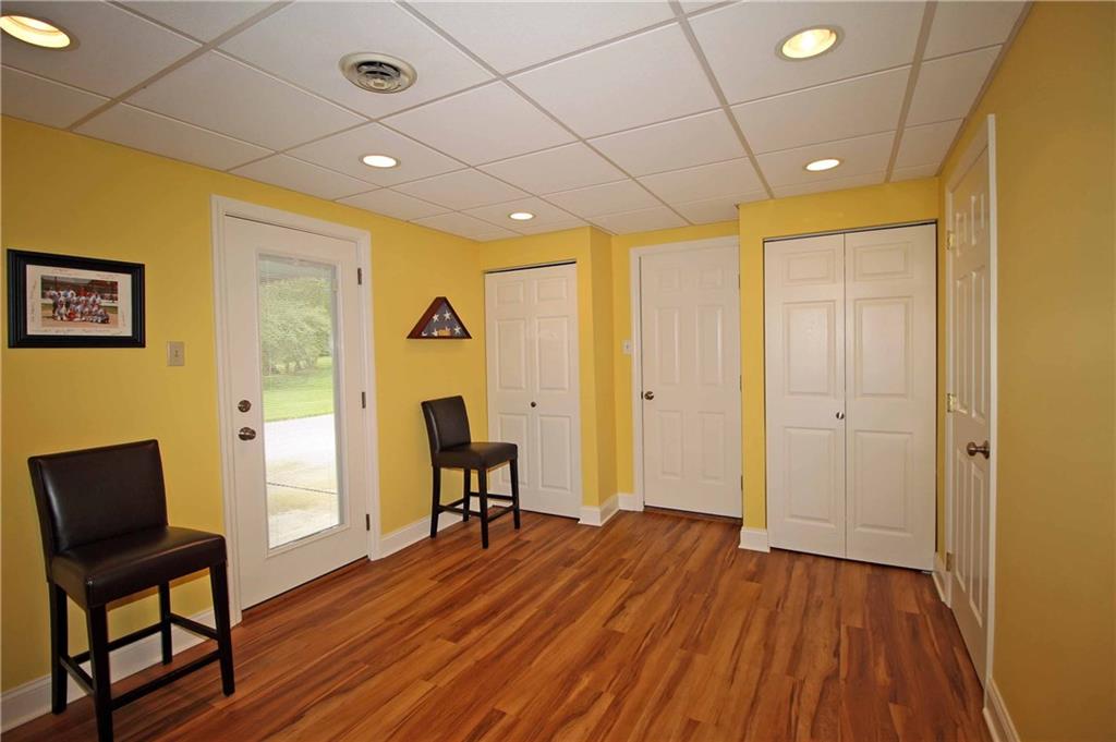 1790 Partridge Run Road Pittsburgh, PA 15241 - Photo 22 of 25 Walk out to the yard from this newly designed game room .Recessed lighting, new white doors with new baseboards and laundry area enclosed.