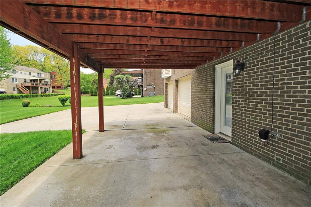 1790 Partridge Run Road Pittsburgh, PA 15241 - Photo 24 of 25 Walk out game room with a patio area. This can be used as a parking space too.