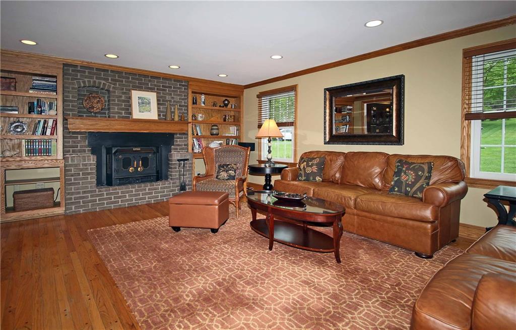 1790 Partridge Run Road Pittsburgh, PA 15241 - Photo 6 of 25 Family room has pegged floor, a log burning fireplace and built in shelving