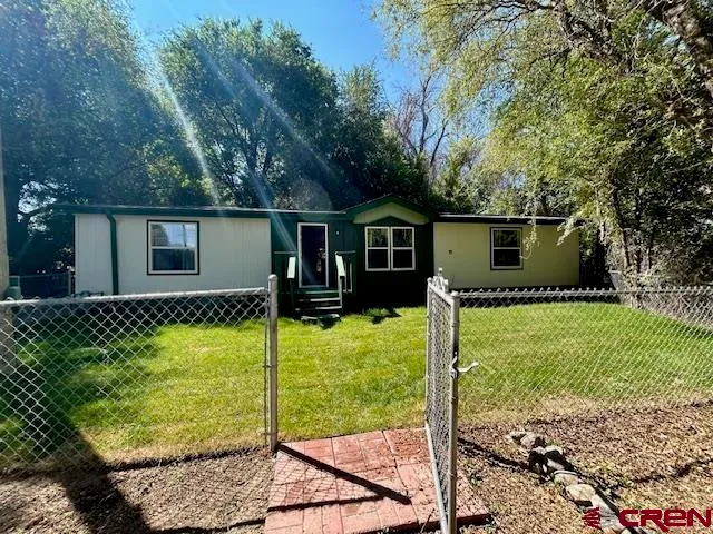 a view of a back yard with green space