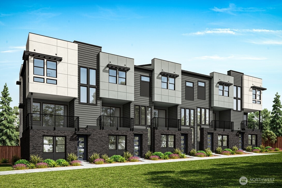 18805 99th Court Northeast, Unit A Bothell, WA 98011 - Photo 1 of 17 a front view of a house with a yard