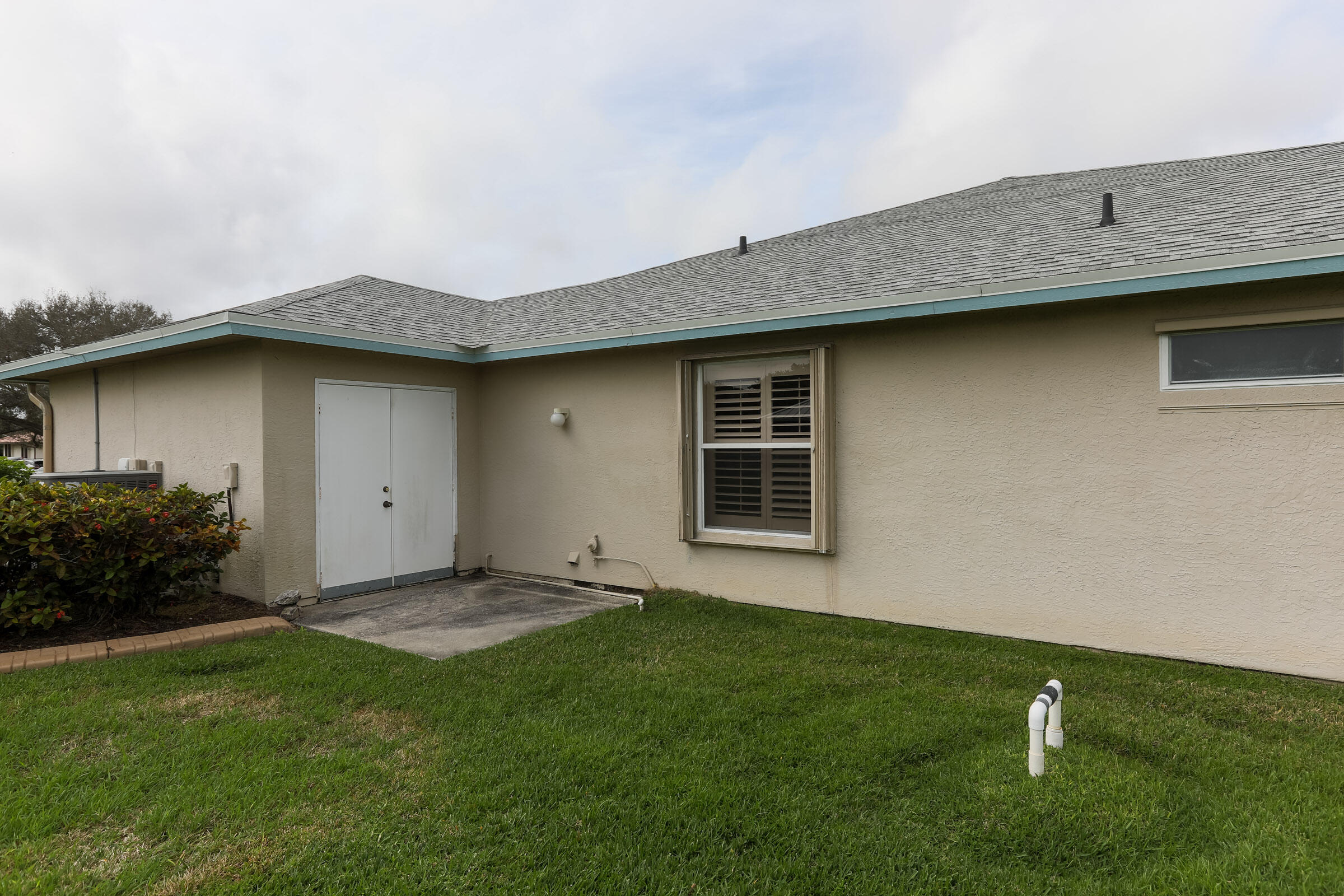 2031 Southeast Pyramid Road Port St. Lucie, FL 34952 - Photo 59 of 79 Rear view of garage with double door
