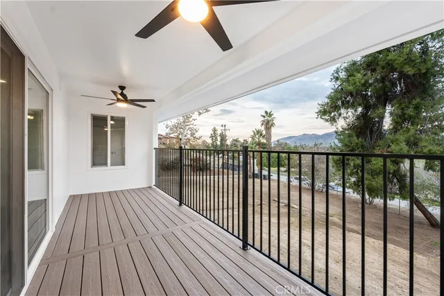 a view of a balcony with wooden floor
