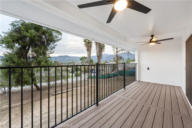 a view of a balcony with wooden floor
