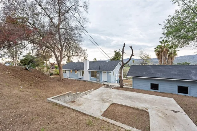 a backyard of a house with lots of green space