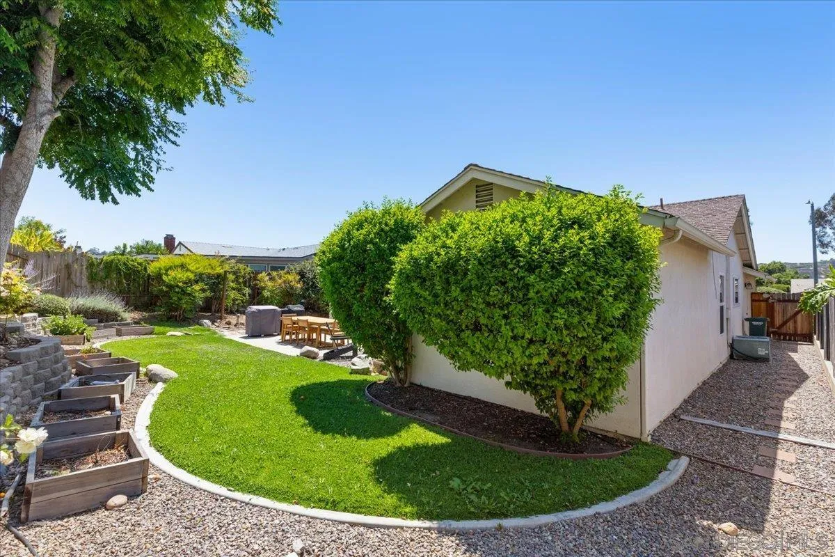 12243 Buckskin Trail Poway, CA 92064 - Photo 27 of 41 a view of a garden with a house in the background