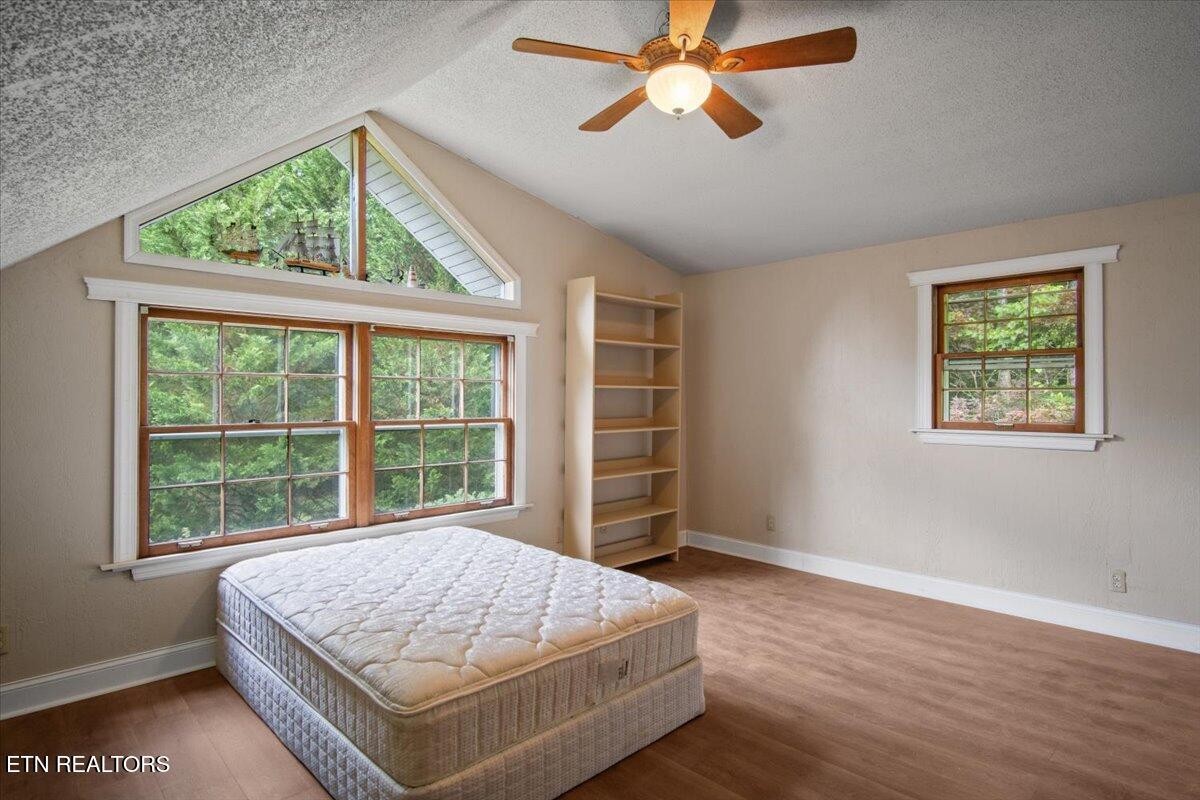 103 Baltimore Drive Oak Ridge, TN 37830 - Photo 23 of 45 a bedroom with a large bed and a window