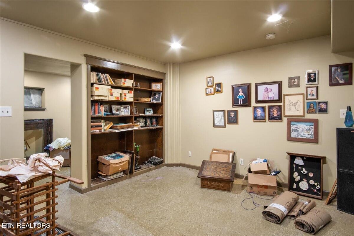 103 Baltimore Drive Oak Ridge, TN 37830 - Photo 41 of 45 a living room with furniture and a bookshelf