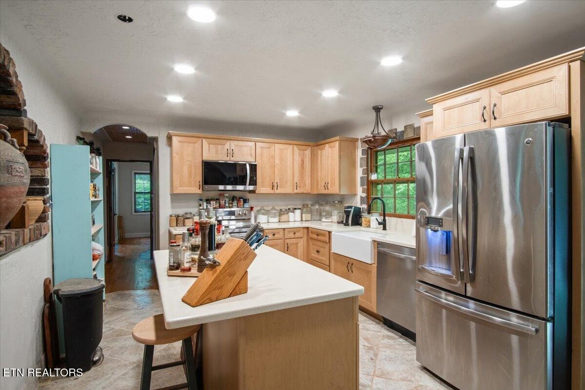103 Baltimore Drive Oak Ridge, TN 37830 - Photo 10 of 45 a kitchen with stainless steel appliances a refrigerator and a stove top oven