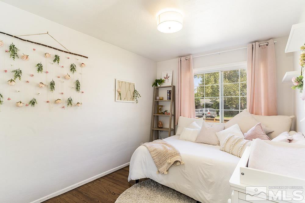815 Lahontan Way Reno, NV 89509 - Photo 12 of 20 a bedroom with a bed and a window with cabinet