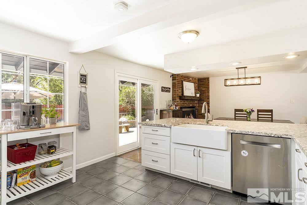 815 Lahontan Way Reno, NV 89509 - Photo 8 of 20 a kitchen with white cabinets and white appliances