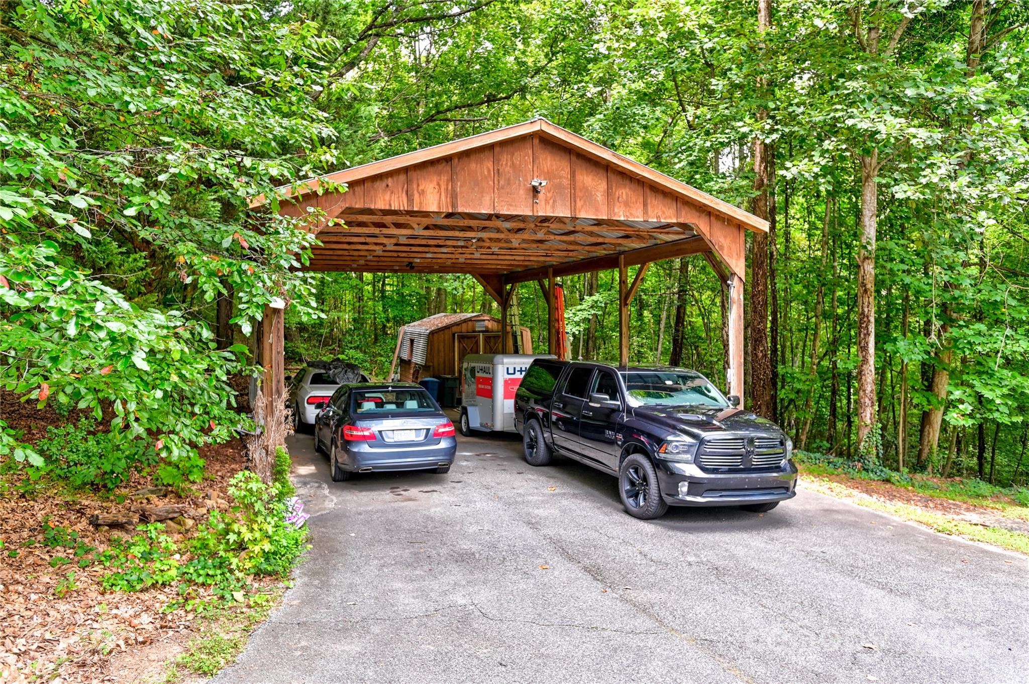 720 Potneck Road Salisbury, NC 28147 - Photo 42 of 48 a car parked in front of a house with large trees