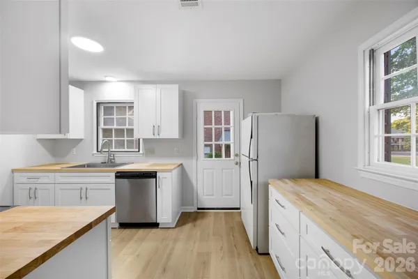 a kitchen with a stove and a microwave