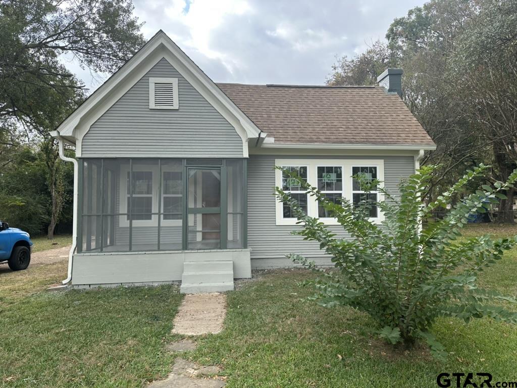 1717 East Houston Street Tyler, TX 75702 - Photo 1 of 10 a front view of a house with a garden