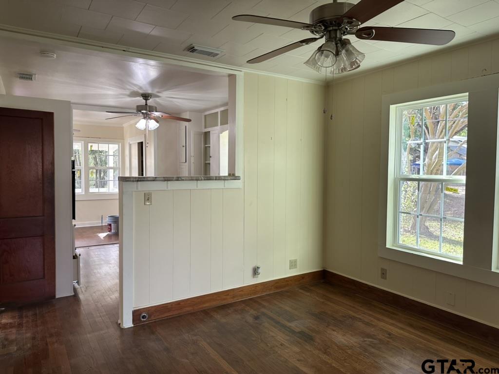 1717 East Houston Street Tyler, TX 75702 - Photo 4 of 10 a view of a livingroom with a ceiling fan and window