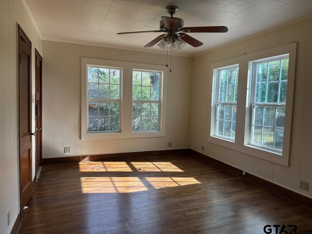 1717 East Houston Street Tyler, TX 75702 - Photo 7 of 10 a view of empty room with wooden floor and fan