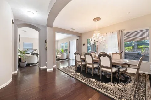 a kitchen with white cabinets and appliances