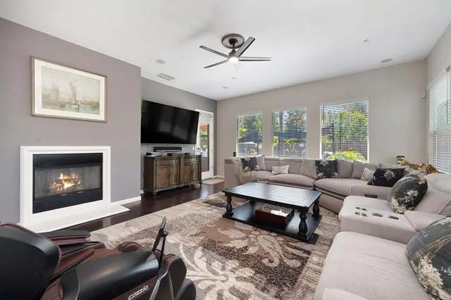 a kitchen with white cabinets and appliances