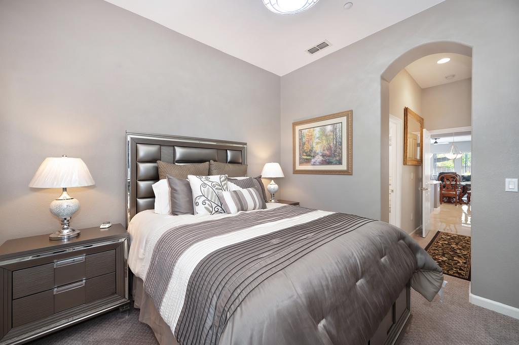1721 Bella Circle Lincoln, CA 95648 - Photo 23 of 66 a bedroom with a bed and lamp
