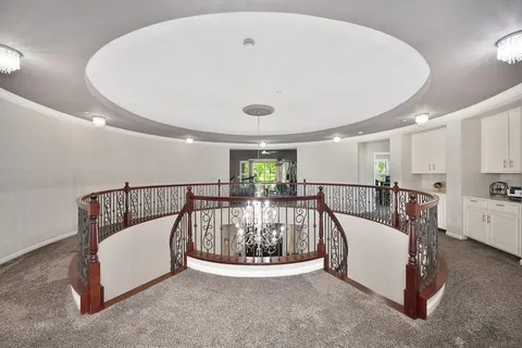 a balcony with furniture and a potted plant
