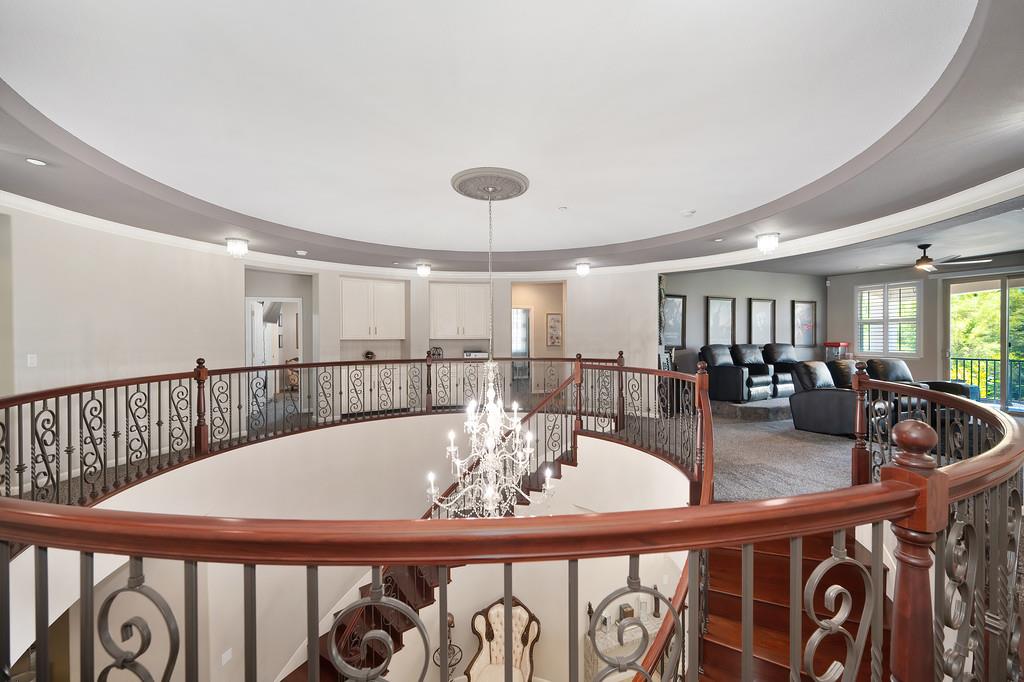 1721 Bella Circle Lincoln, CA 95648 - Photo 25 of 66 a view of a dining room with furniture and a table and wooden floor
