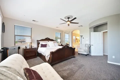 a room with gym equipment and windows