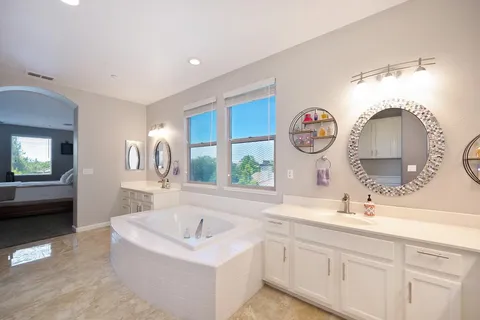 a utility room with sink dryer and washer