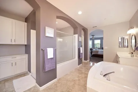 a kitchen with white cabinets and a sink