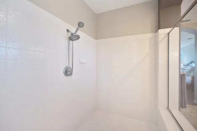 a view of a park with plants and large trees