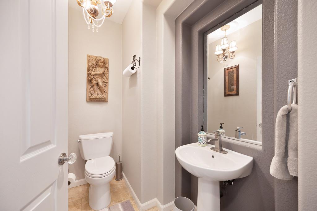 1721 Bella Circle Lincoln, CA 95648 - Photo 44 of 66 a bathroom with a toilet sink and mirror
