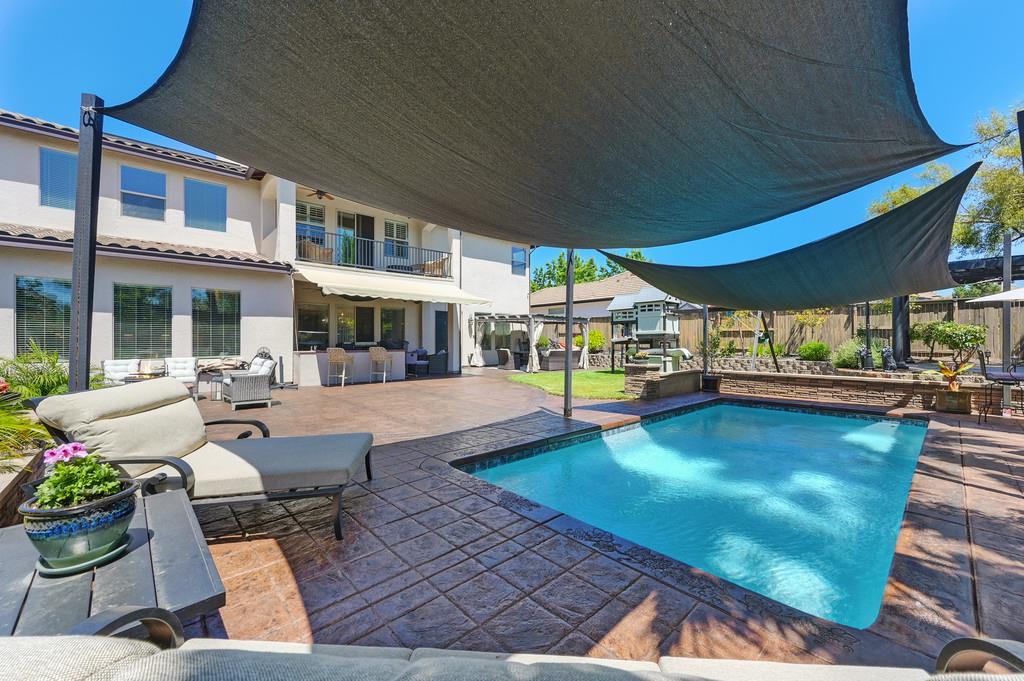 1721 Bella Circle Lincoln, CA 95648 - Photo 52 of 66 a view of a patio with swimming pool table and chairs